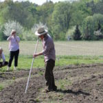 Bauern mit Rechen